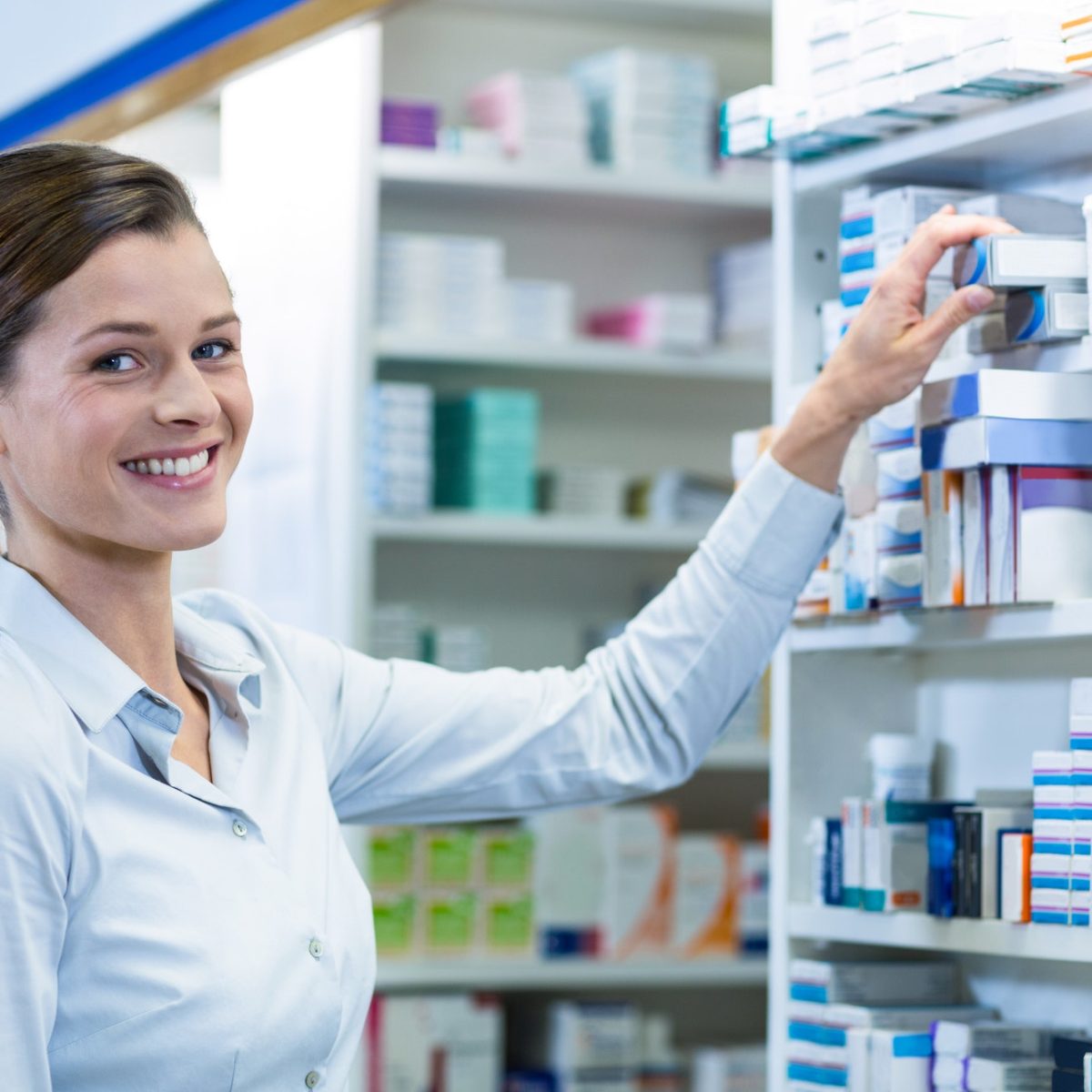 pharmacist-checking-a-medicine-in-pharmacy.jpg