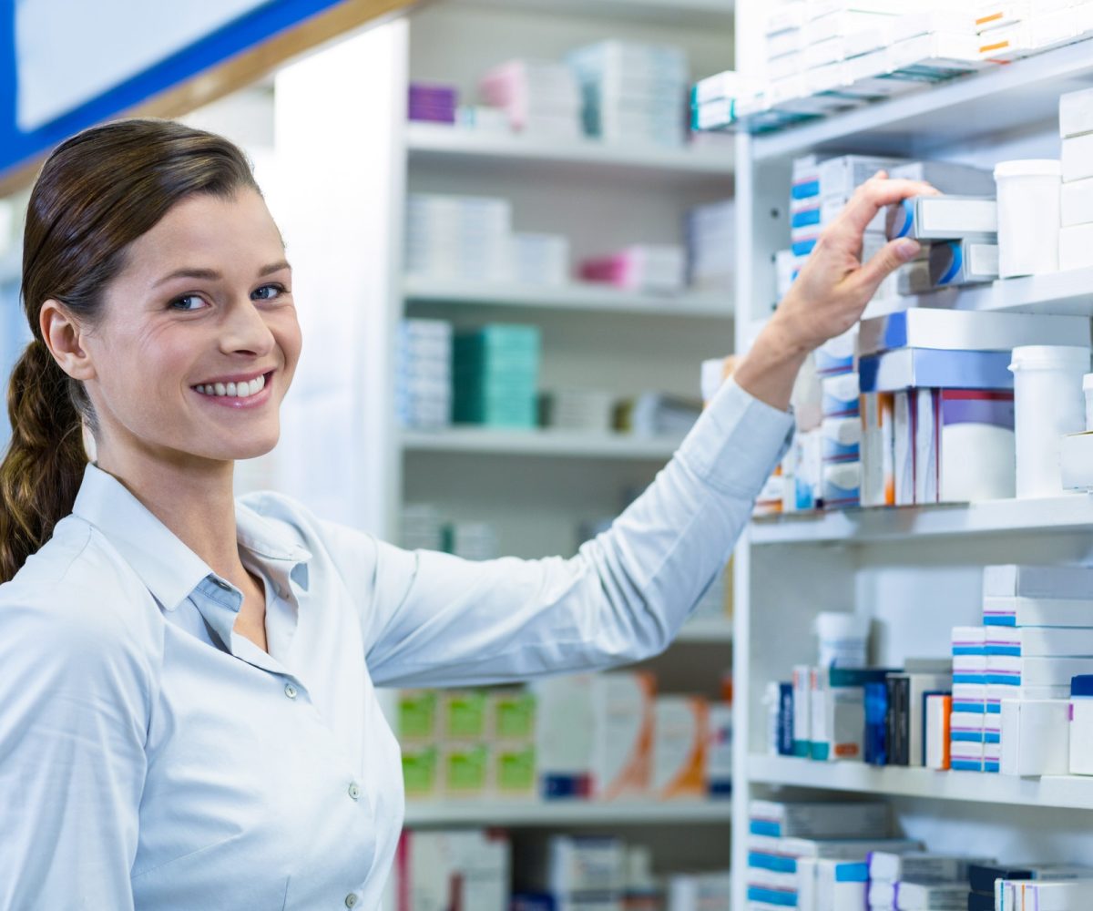 pharmacist-checking-a-medicine-in-pharmacy.jpg